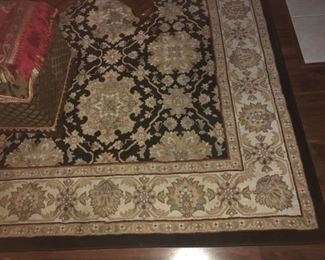 CLOSE UP VIEW OF HIGH QUALITY PERSIAN STYLE WOOL RUG WITH 3 DESIGN BORDERS
