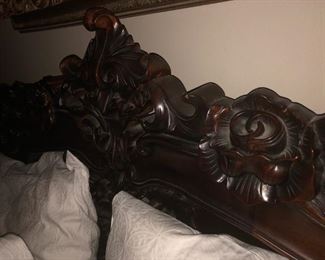 CLOSE UP ORNATE VIEW OF ROCOCO CARVED HEADBOARD ORNATE CARVED CENTER PIECE CLOSE UP VIEW OF HIGHLY CARVED ROCOCO FLORAL  MAHOGANY KING SIZE BED WITH NEW CUSTOM MATTRESS 