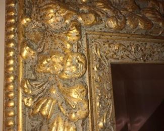 CLOSE UP VIEW OF ORNATE GOLD FLORAL FRAME OF LARGE ORNATE CARVED GOLD GILDED ROCOCO WALL MIRROR - NO DAMAGE AND IN EXCELLENT CONDITION 