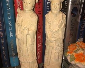 CLOSE UP VIEW OF A PAIR OF CHINESE MAN & WOMAN TALL CARVINGS ON WOOD PEDESTALS