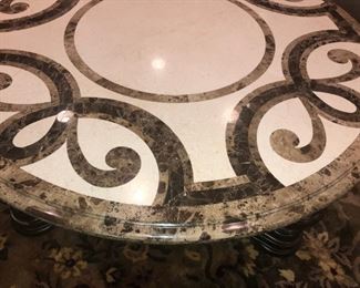 CLOSE UP VIEW OF MAITLAND LARGE ROUND OVAL COCKTAIL TABLE WITH ORNATE INLAID MARBLE - EXCELLENT CONDITION AND GENTLY USED