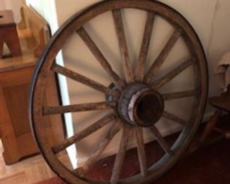 Everyone needs a solid wagon wheel!  This actually can be turned into a table!  We have the glass top that was custom cut to fit the top!  The crock can be purchased to be the base!  That is how it was originally.....well, after it was used on a wagon!  