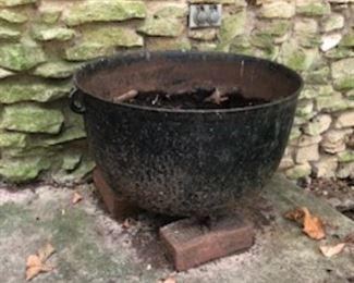 Large black metal cauldron!  The huge planter that doesn't tip over!  :)