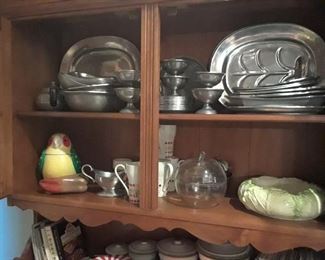 A few of the many pewter serving pieces found in various cabinets