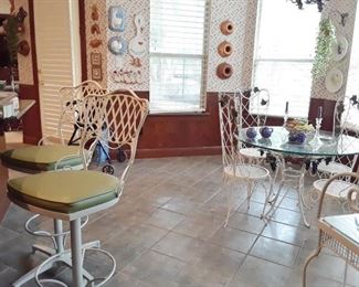 White metal bar stools and a dining set