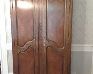Walnut armoire for any room in the house. This one is loaded with dinnerware and pewter.