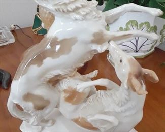 Lovely porcelain figurine of two dogs playing