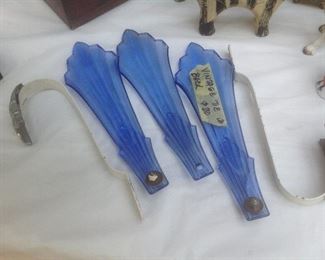 Antique drapery tieback holders in royal blue glass