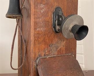 Hello? The early 20th Century is calling....Antique wooden crank phone on the party line... 