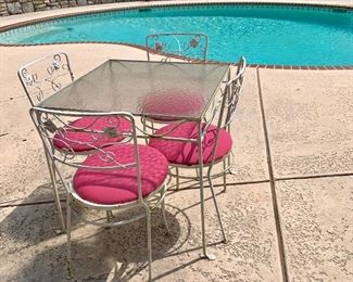 Simple makes fun with this square wrought iron glass top table with 4 chairs. So sweet!
