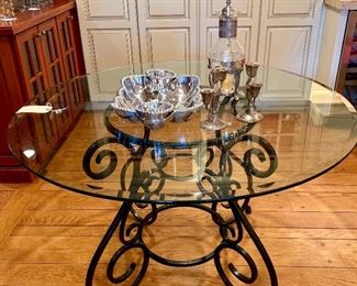 Glass top bistro table with iron base.