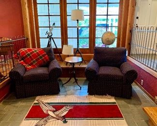 Pheasant rug and two oversized upholstered club chairs.