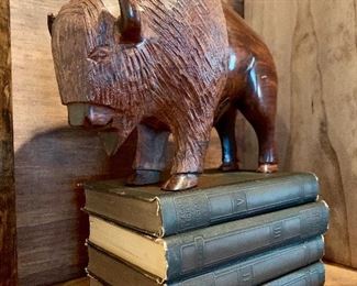 Wood bison on collection of vintage books.