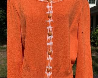 St. John orange sweater.