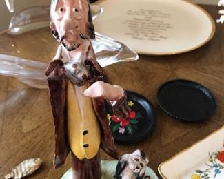 Porcelain man and dog signed by Caesar Poli