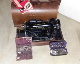 singer sewing machine with attachments cover and book yes- another photo
