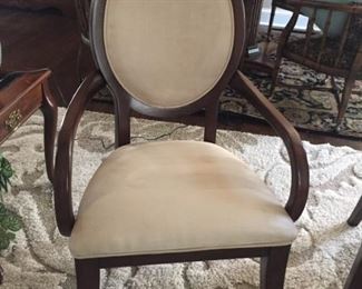 One of two beautiful wood and micro fiber arm chairs