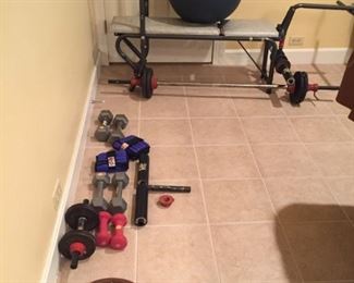 Exercise equipment: Bench with barbell, dumbell, hand weights, yoga ball