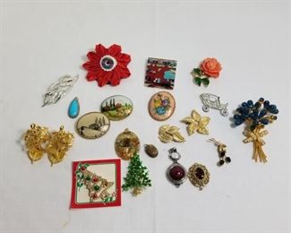 Collection of vintage costume jewelry pins and pendants https://ctbids.com/#!/description/share/233774