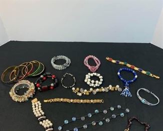 Assortment of Costume Jewelry bracelets and rings https://ctbids.com/#!/description/share/233779