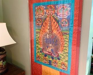 A silk Tibetan wall hanging purchased during their travels