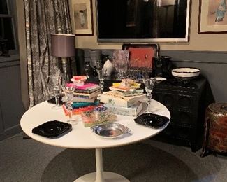 The den is filled with treasures from the ladies many trips to Asia. In the foreground we can see a Saarinen tulip table for Knoll filled with books on Bridge!