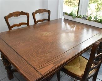 Antique Expandable Carved Oak Dining Table & 4 Chairs with Rattan Seats