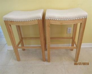 2 STOOLS FOR UNDER A COUNTER... NATURAL WOOD AND NATURAL COLOR FABRIC