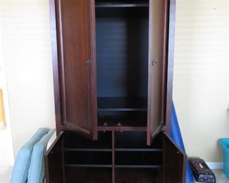 HERE IS AN ENTERTAINMENT CABINET THAT WILL HOLD A FLAT SCREEN TV AND ELECTRONICS WITH STORAGE ON THE BOTTOM.. BACK IS STILL IN TACT SO YOU CAN TAKE IT OUR FOR YOUR TV OR NOT.. DARK CHERRY WOOD AND GORGEOUS