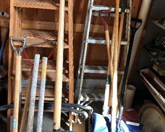 Numerous axes, snow shovels, ladders, etc.