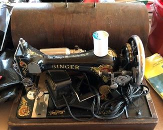 Antique Singer sewing machine with case.