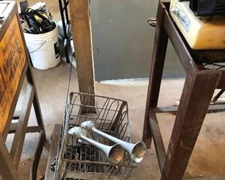 Antique scale; automobile horns -- perhaps horns that belonged to a truck.