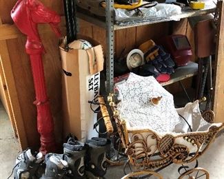 Small baby carriage (ornamental?); volleyball set; metal horse sculpture.