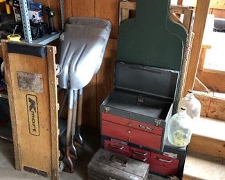 Carts, numerous tool boxes, multiple shovels, etc.