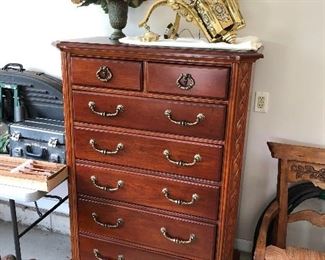 Dresser; ornate brass light fixture.