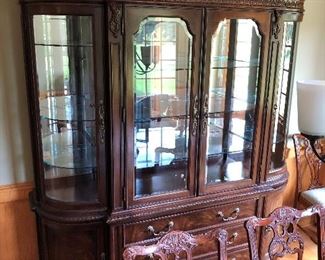 Striking Bernhardt china cabinet with curved and beveled glass.