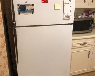 vintage fridge with teak wood handles (is it me or is there tons more space in these old refrigerators?)