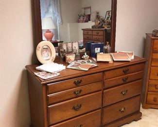 slightly cluttered dresser with brass nipples