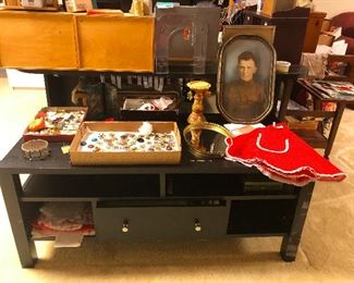 Great great granduncle Morris eyes the frilly red apron longingly