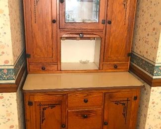 Antique Oak Hoosier Cabinet with sliding metal work surface.
