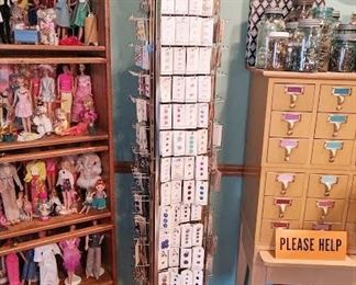 Buttons on cards on a display from Ben Franklins in Palos Heights when they closed, signed by family.