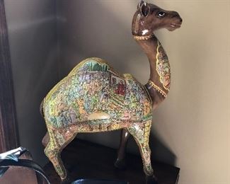This ivory embossed Papier or Paper Mache Camel is  the finest and highest form of Papier Mache art, which is very rarely done nowadays. Only the finest Papier Mache artisans us paint that has 24K gold infused and indulge in creating such intricate art as it needs absolute dedication, skill, finesse and above all lot of time to complete such ornate object.It’s hard to believe that these pieces begin as molded paper pulp. While the basic shape comes from a mold, the last layer before painting is freshly applied, and sculpted (or embosses) by hand. After passing through the hands of several artisans and craftsmen, each specializing in a specific layer of process, an object of exquisite beauty comes to life. These artisans have inherited the essential skills and aesthetic intelligence that it takes to fashion this art.