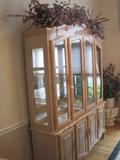 Beautiful large lighted china cabinet with four glass doors/ 3 glass shelves with mirrored back and storage on the bottom