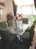 Handmade large 4'x7' beveled glass top dining table with petrified wood base
table can seat eight
6  parsons chairs in dark green upholstery