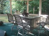 Patio bar set with 4 bar chairs that swivel