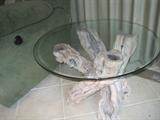 Handmade round glass end table with  petrified driftwood base