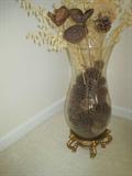 Large glass vase of dried flowers