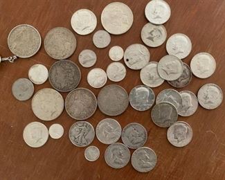 Just a small portion of the antique coin. There will be more photos as soon as possible. 1964 Kennedy half dollars...liberty silver dollars...etc.
