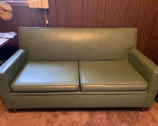 vintage 1960's Mid Century Modern couch that is a hide a bed.