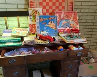Vintage games and toys..Carrom board..battling tops..big business..goofy klock..dog house..domino's..dutch blitz..card set with pop eye and others. Also this beautiful desk and desk light